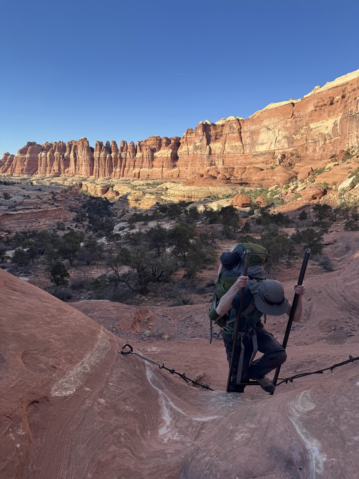 Climbing down a ladder in the canyon