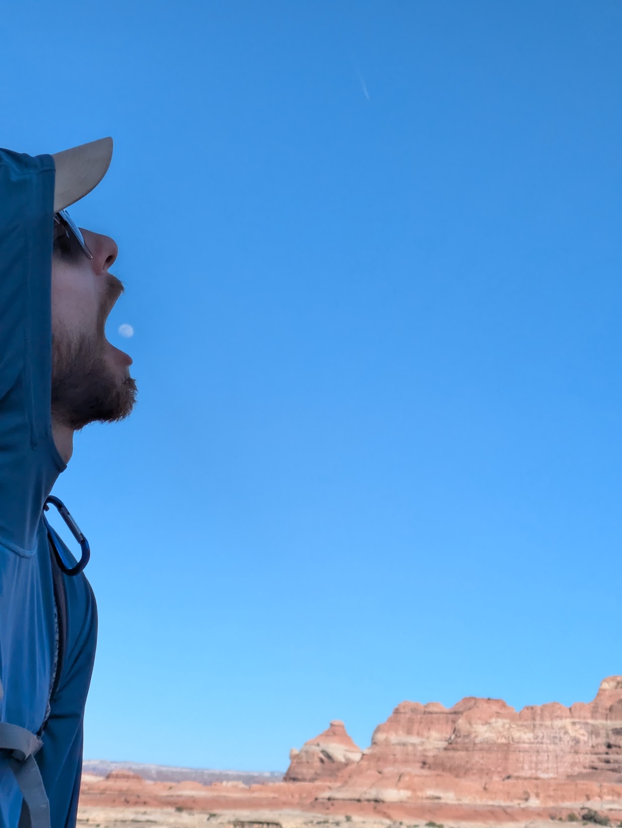 A picture of my partner pretending like he is pacman eating the moon